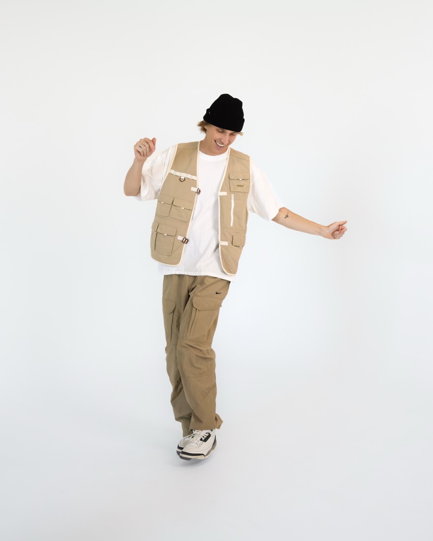 BBYFERG dancing in a utility vest and beanie